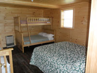 Log Cabin Rental Photos - Living Room Looking Toward One Bedroom and the Stairs - Maine Whitewater