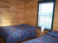 Log Cabin Rental Photos - Living Room Looking Toward One Bedroom and the Stairs - Maine Whitewater
